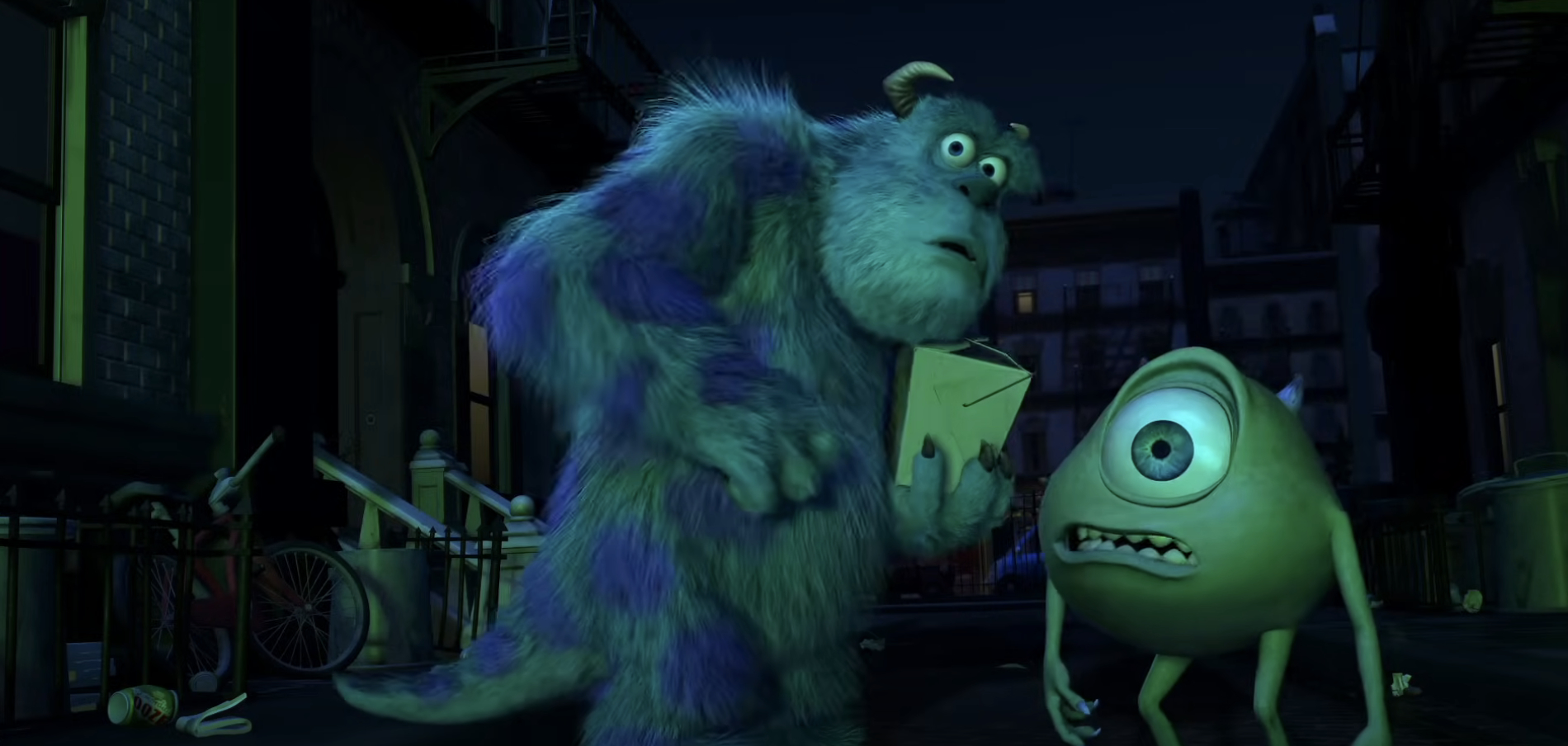 Sully, a large blue furry monster, and Mike, a small green one-eyed monster, from Monsters, Inc., look worriedly at a piece of paper in a dark alley
