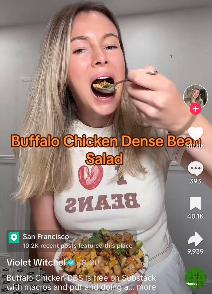 TikTok screengrab of Violet Witchel in a kitchen eating Buffalo Chicken Dense Bean Salad