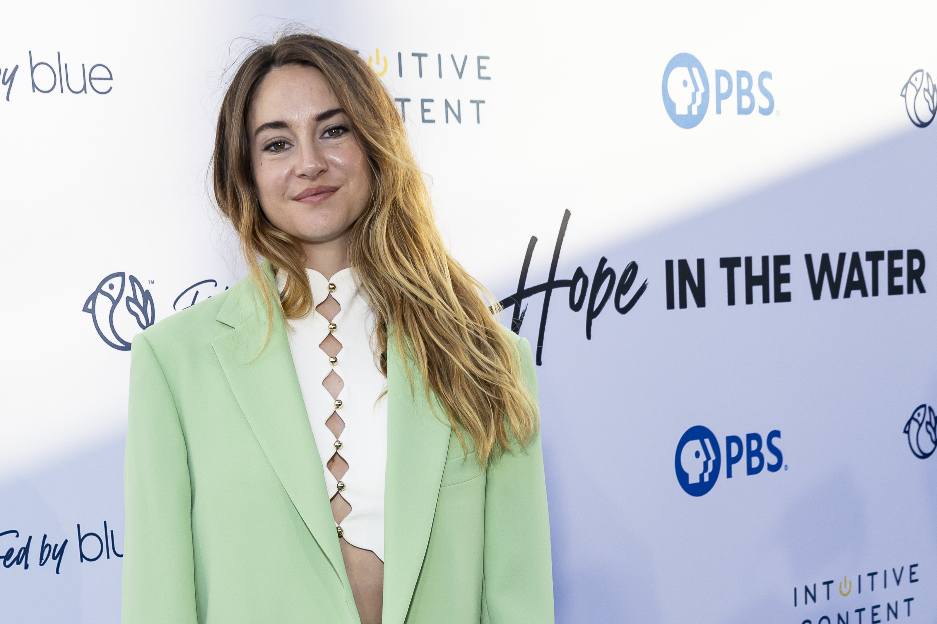 Shailene Woodley at a Hope in the Water event, wearing a blazer and top with geometric cutouts