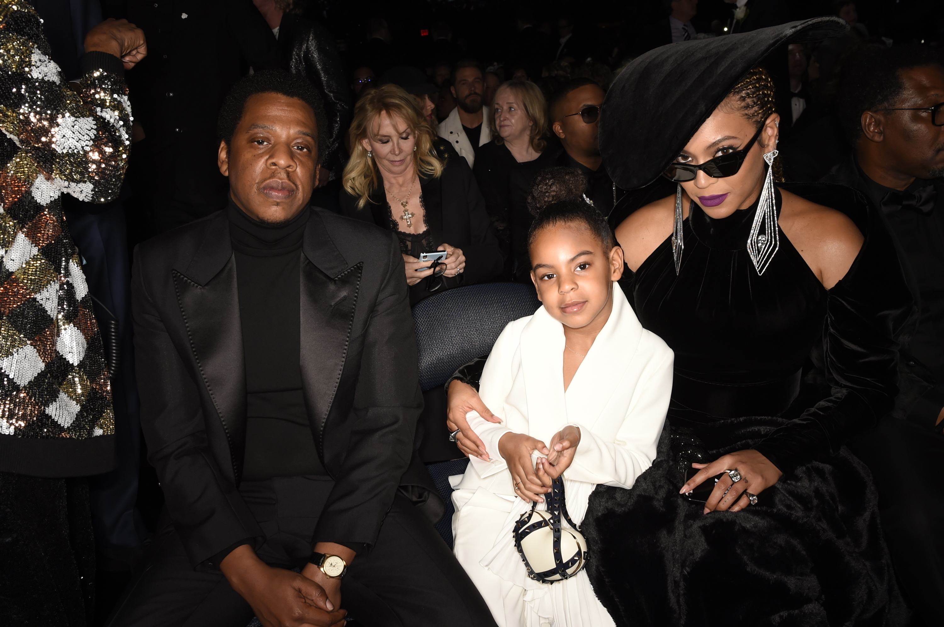 Jay-Z, Beyoncé, and their daughter Blue Ivy sit together at an event