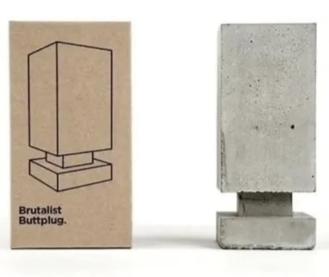 Rectangular concrete block next to a box labeled "Brutalist Buttplug" with a minimalist illustration of the item