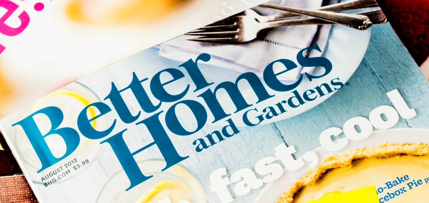 A stack of magazines with a "Please Recycle!! :)" sticky note on top. The visible magazines include Better Homes and Gardens and articles about natural beauty and lifestyle