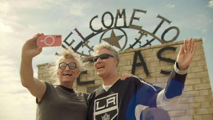 Harper Steele and Will Ferrell pose for a selfie in front of a &quot;Welcome to Texas&quot; sign.