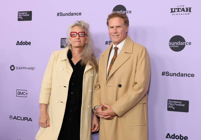 Harper Steele in a beige coat and red glasses, and Will Ferrell in a beige coat and tie, pose at the Sundance Film Festival 2024