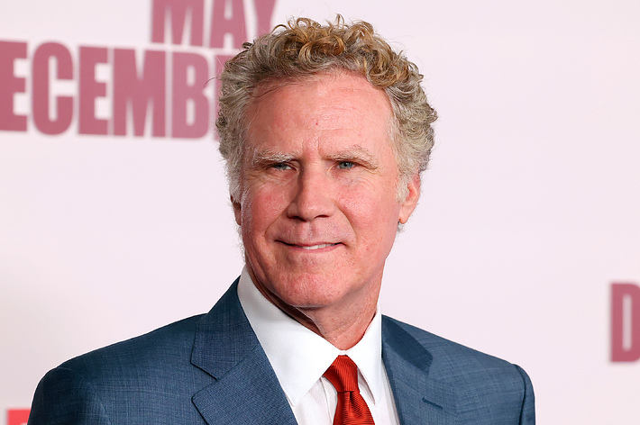 Will Ferrell wearing a blue suit and red tie at the premiere of "May December."