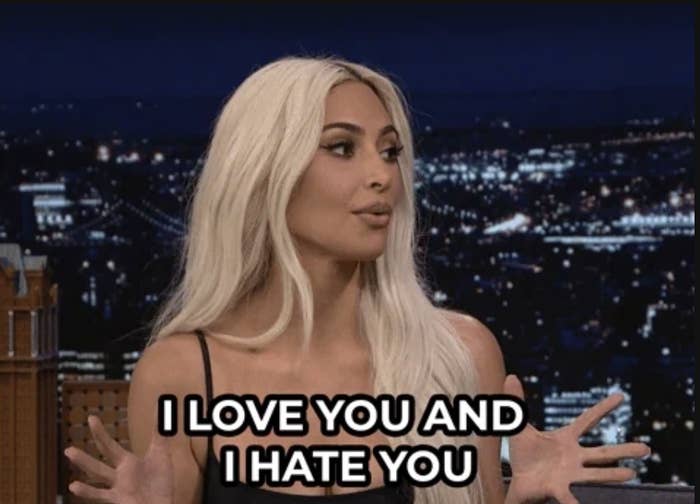 Kim Kardashian, on a talk show set, I LOVE YOU AND I HATE YOU