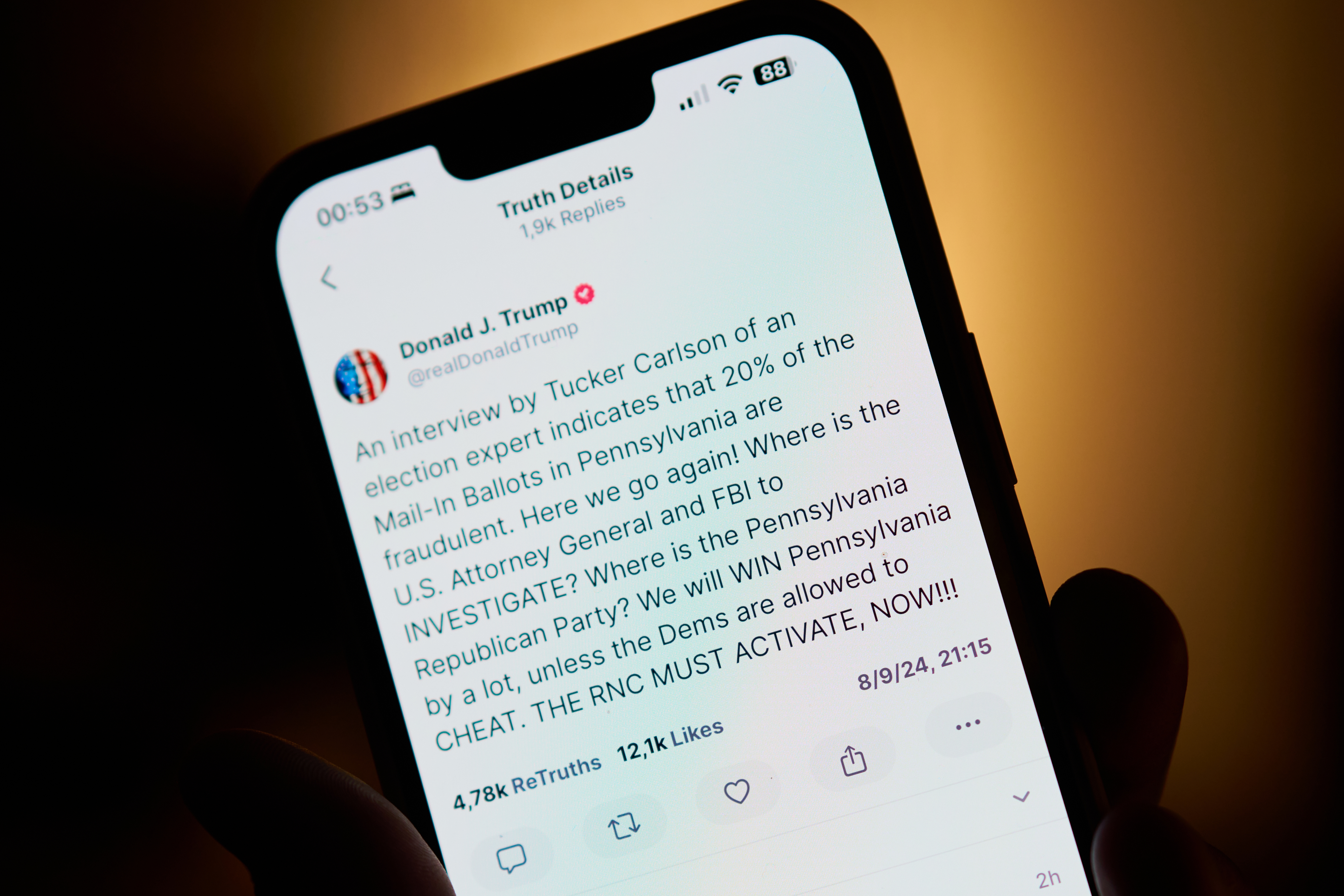 A smartphone screen showing a tweet by Donald J. Trump about mail-in ballots in Pennsylvania and questioning the investigation by the U.S. Attorney General and FBI
