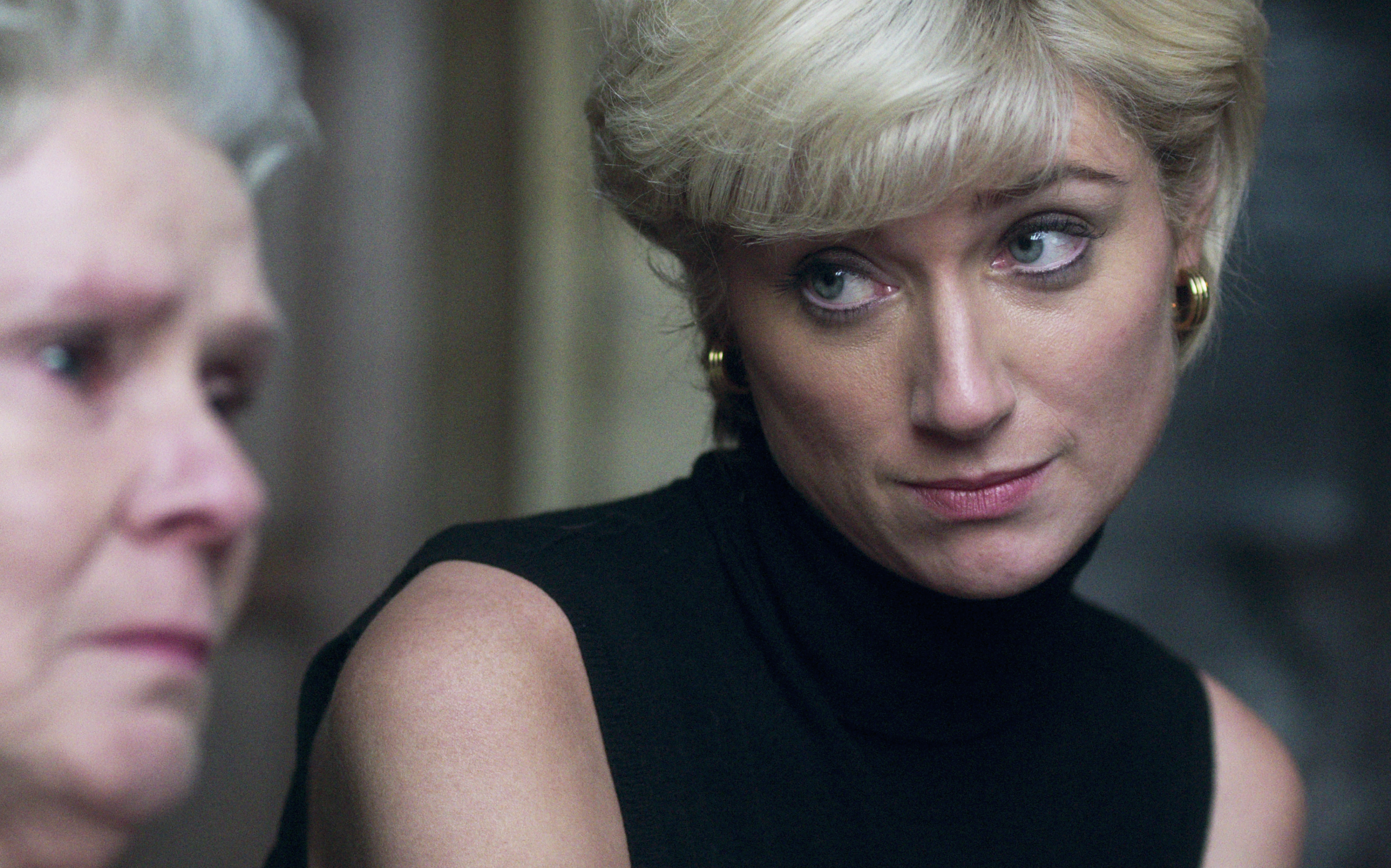 Elizabeth Debicki as Princess Diana and an older woman in emotional conversation from a scene in &quot;The Crown.&quot;
