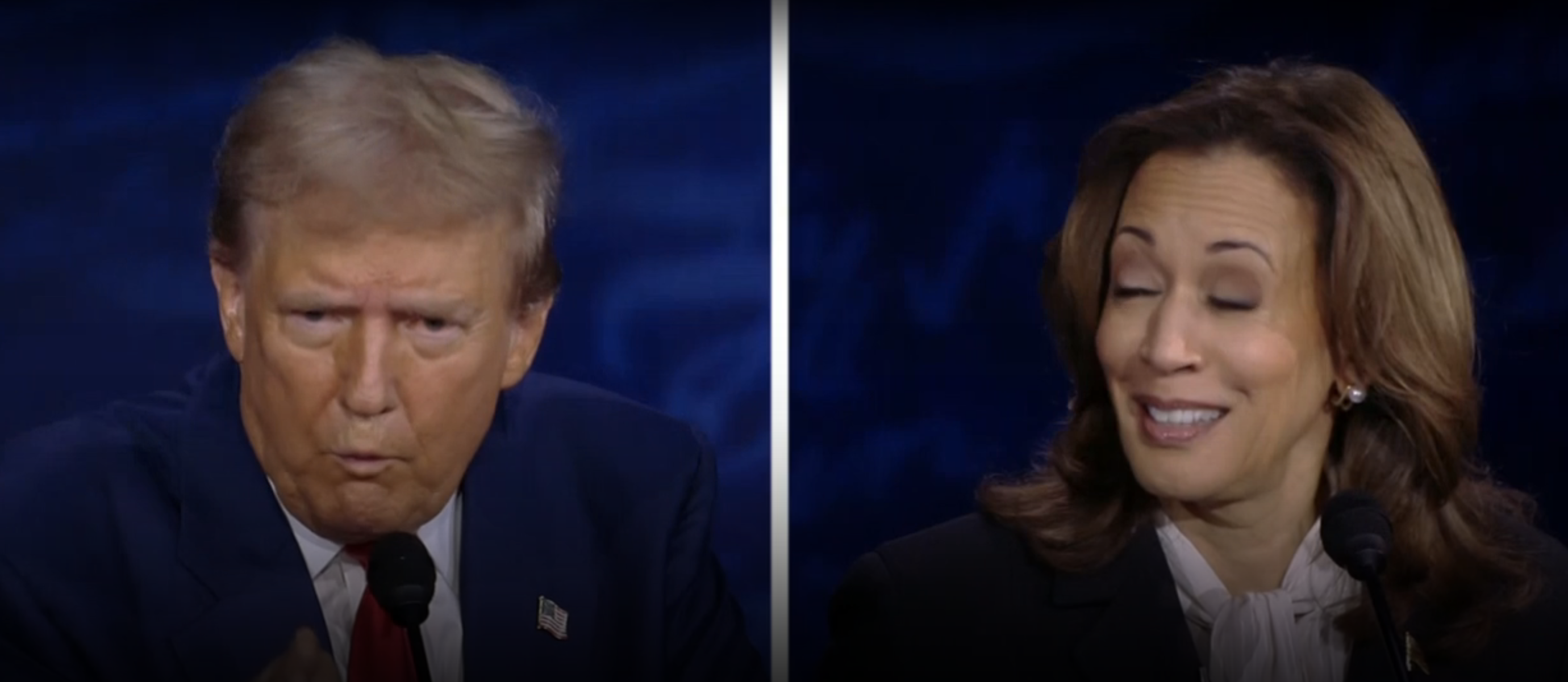 Donald Trump and Kamala Harris on a blue debate stage, both speaking at podiums. Trump appears serious, while Harris is smiling