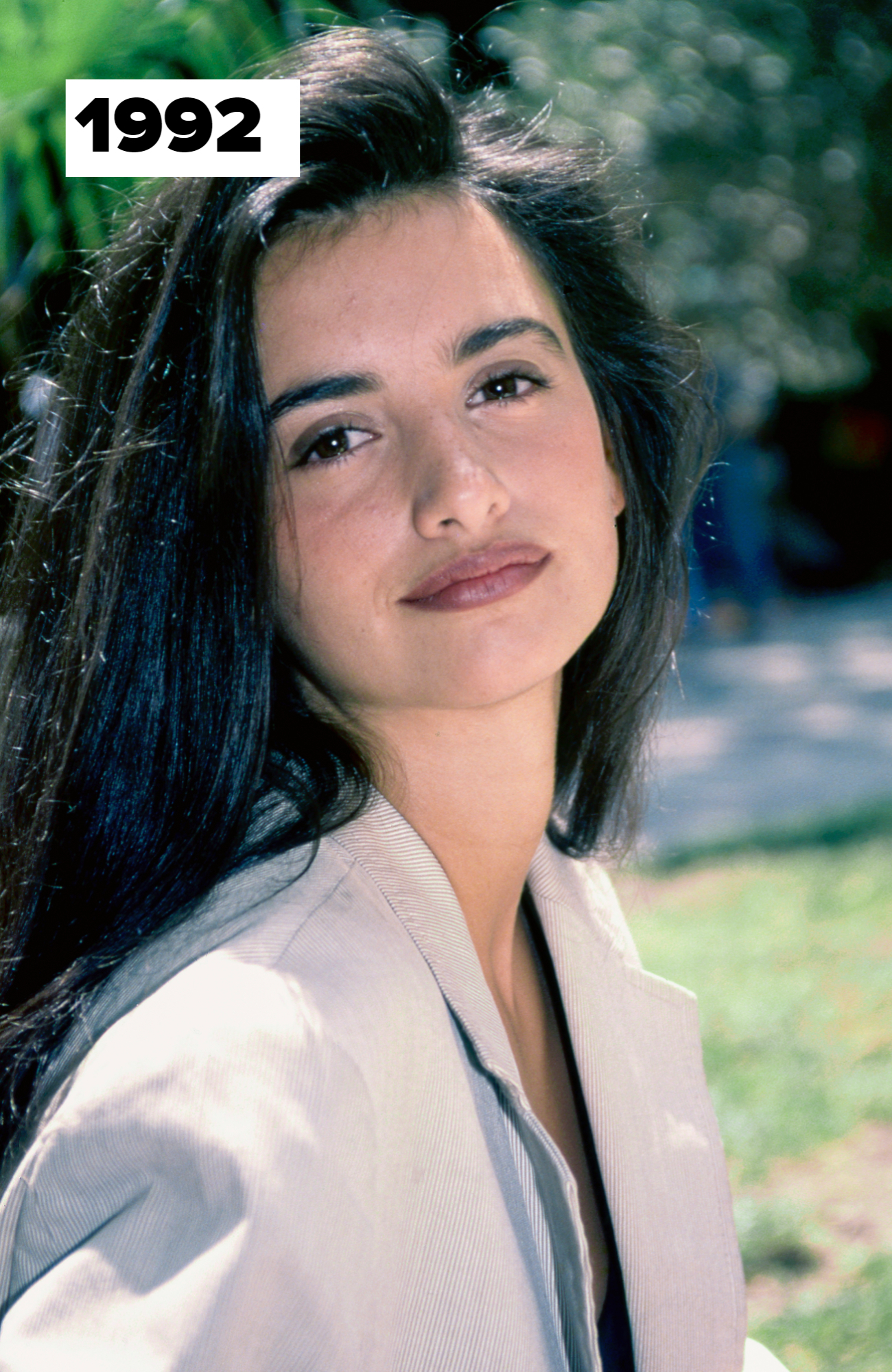 Penélope Cruz, wearing a blazer, poses outdoors with a slight smile