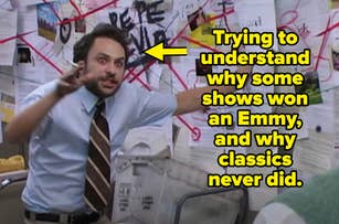 Man in a white shirt and tie pointing at a cluttered wall with pictures and red string, with the text: "Me trying to figure out why some shows won an Emmy and why classic never won."
