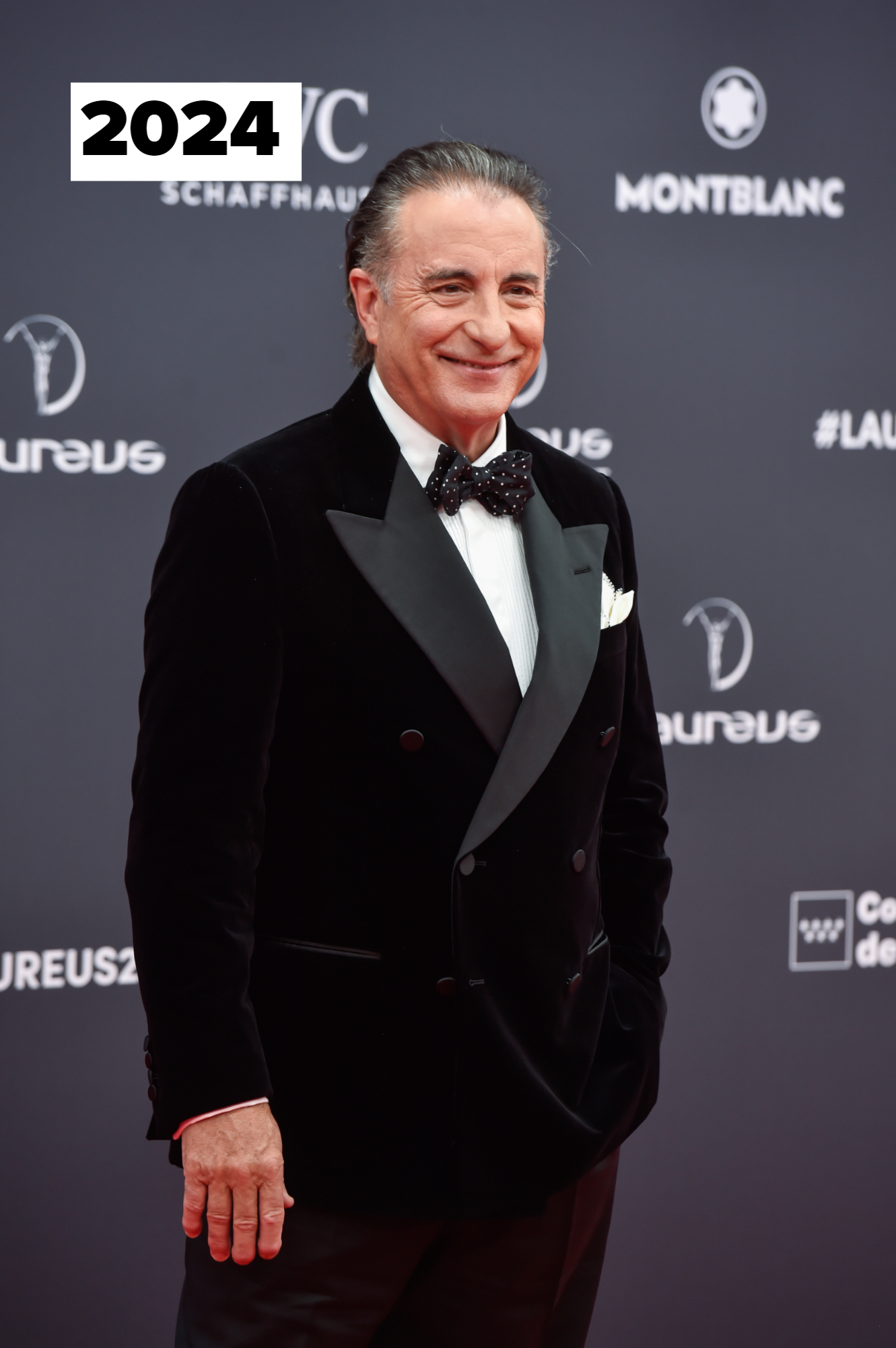 Andy Garcia in a black velvet tuxedo with a bow tie on the red carpet at the Laureus Awards