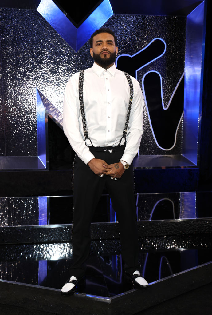 Joyner in a shirt with trousers and suspenders at an MTV event