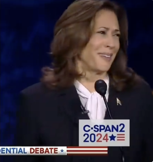 Kamala Harris speaks into a microphone at the C-SPAN2 2024 Presidential Debate