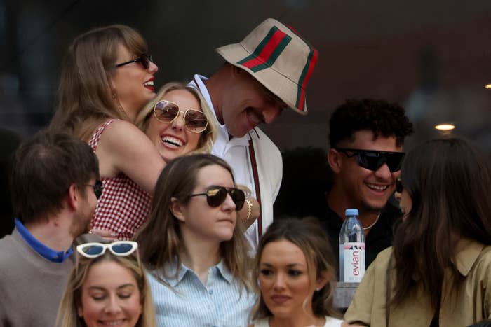 Taylor Swift, Blake Lively, Ryan Reynolds, and Patrick Mahomes with a group of friends are seen enjoying an event together