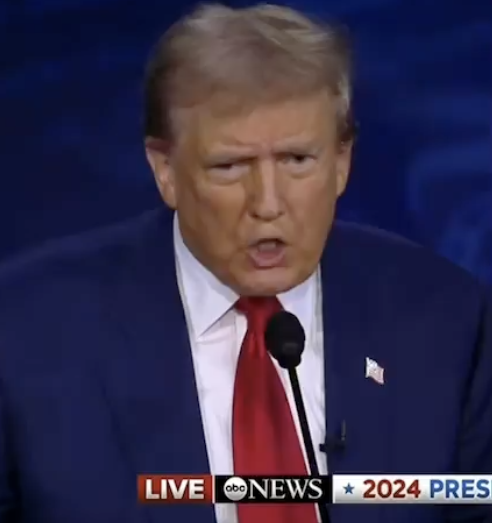 Donald Trump speaking into a microphone during a 2024 presidential debate broadcast live on ABC News
