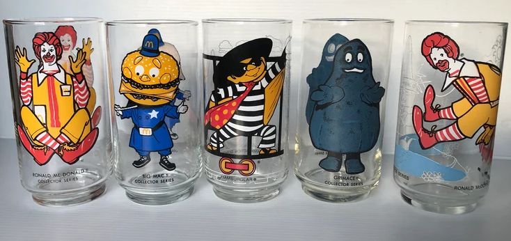 Ronald McDonald, Big Mac, Hamburglar, Grimace, and Ronald McDonald (disco) collector series glasses featuring characters from McDonald's