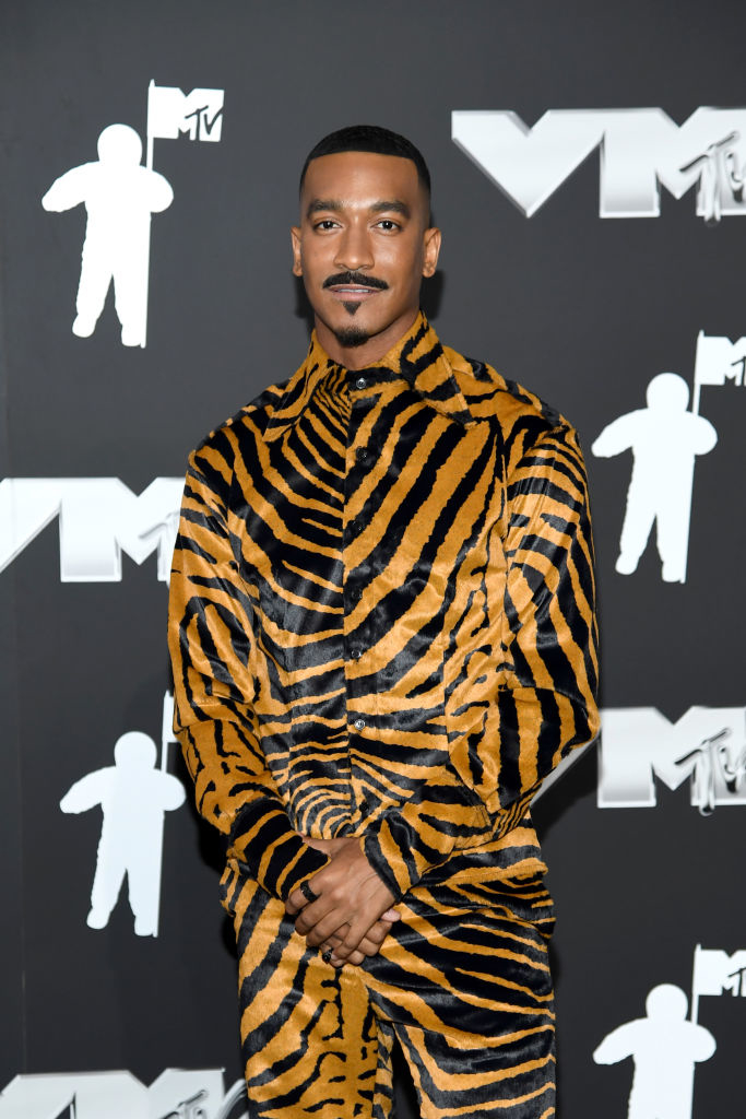 Sean Bankhead at MTV VMAs, wearing a striking tiger print jacket and pants ensemble