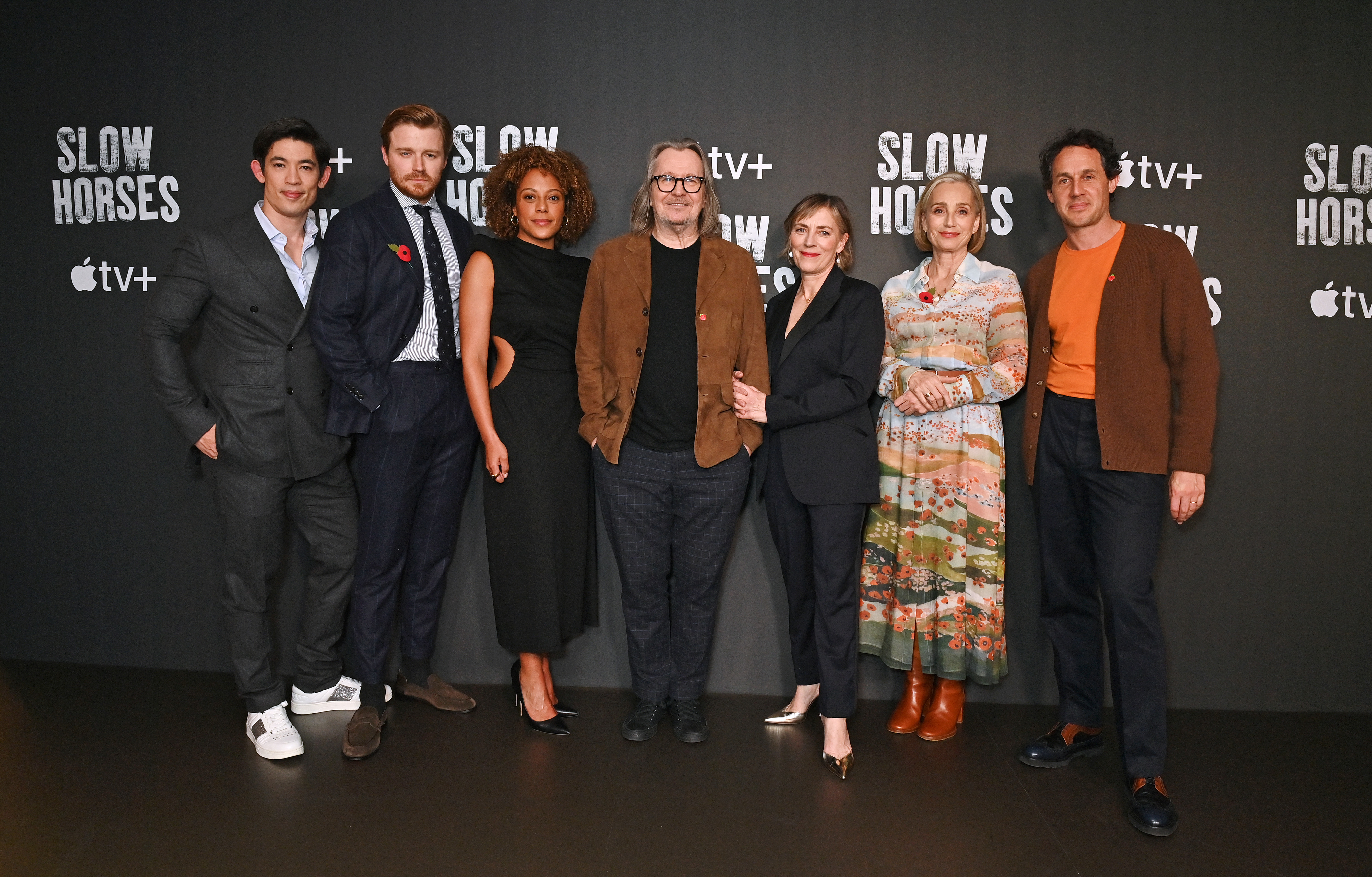 Group of seven people at a "Slow Horses" event