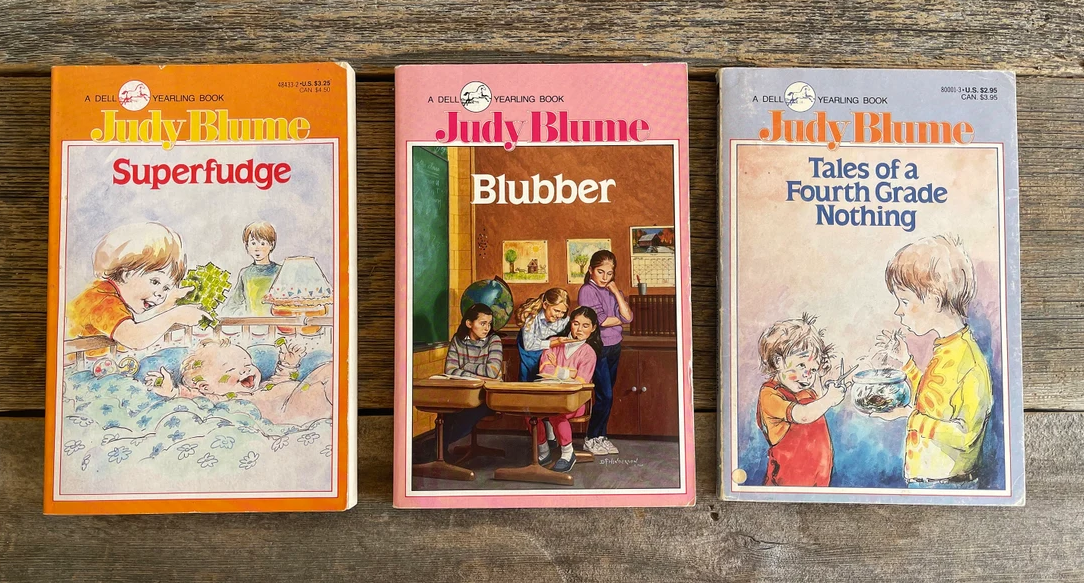 Three Judy Blume book covers: "Superfudge," "Blubber," and "Tales of a Fourth Grade Nothing," each featuring illustrated scenes related to their stories