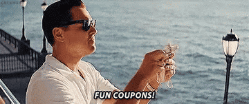 Leonardo DiCaprio tearing money in a scene from the movie "The Wolf of Wall Street" with the caption "FUN COUPONS!"