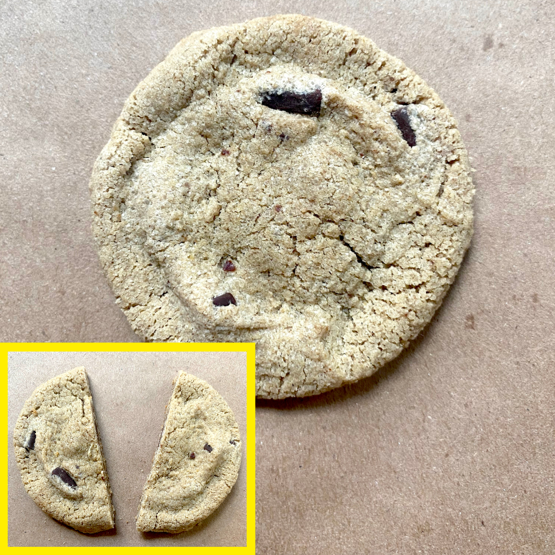 Whole chocolate chip cookie on brown background with an inset image showing the cookie broken in half