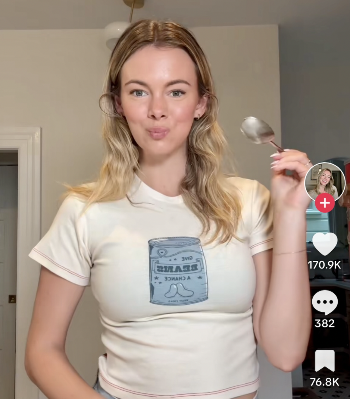 Violet Witchel looks happy while holding a spoon