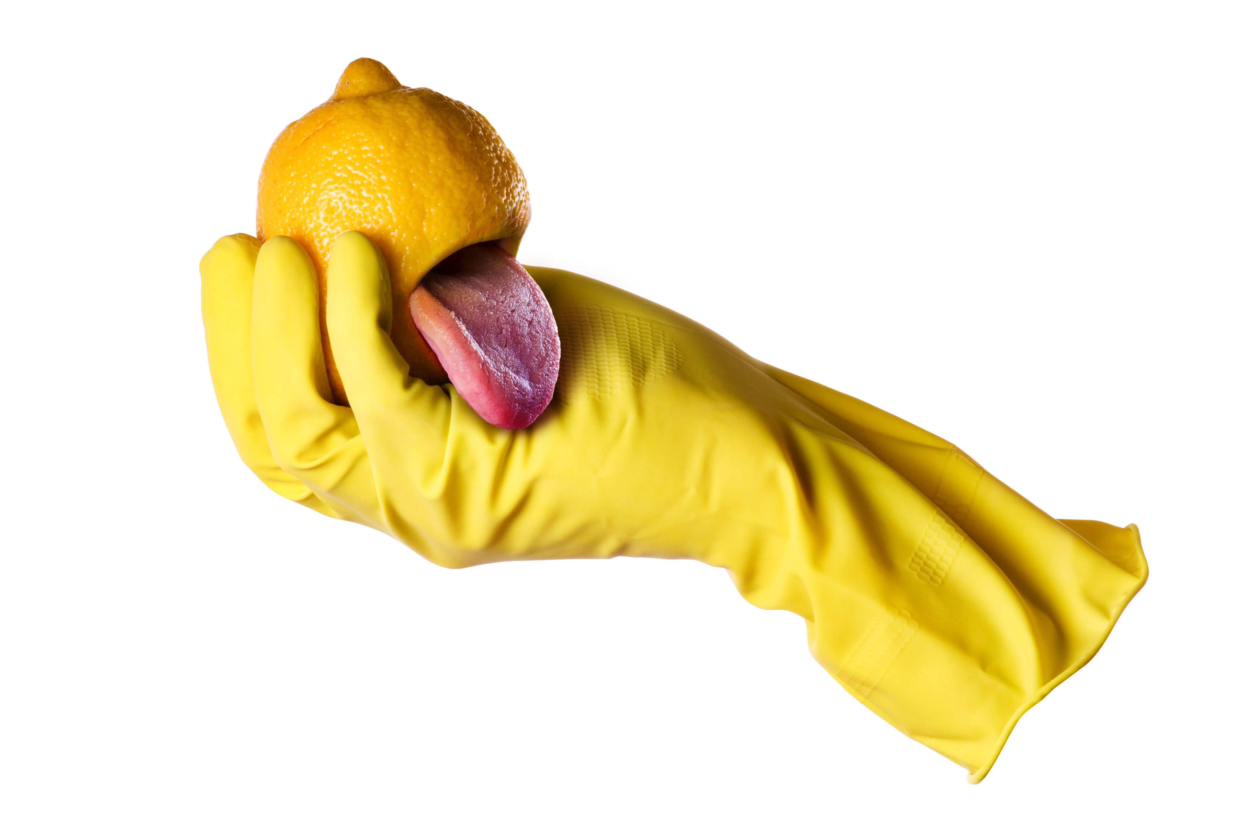 A hand wearing a yellow cleaning glove holds a lemon with a pink tongue sticking out, creating a humorous and surreal image