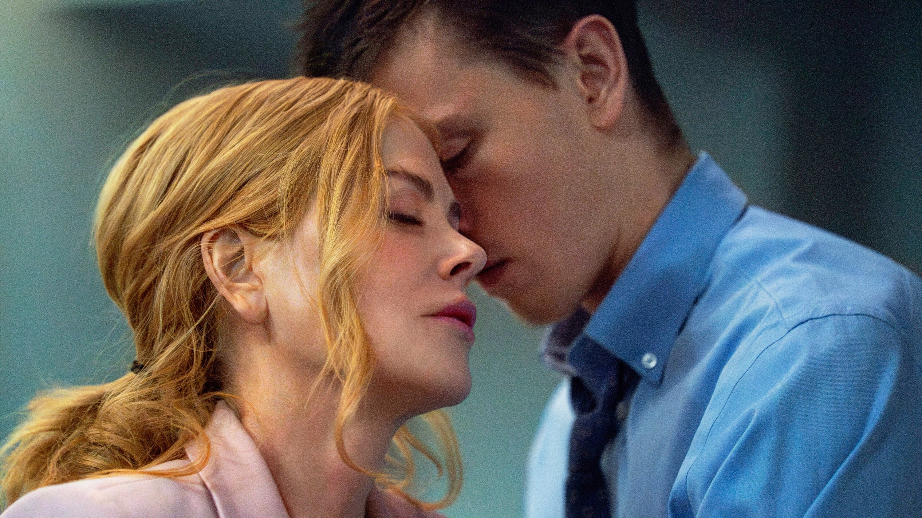 Nicole Kidman and Bill Skarsgård share an intimate moment in a scene, with Nicole leaning her head close to Bill, who has his eyes closed