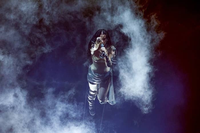 Katy Perry performs suspended in the air amidst smoke