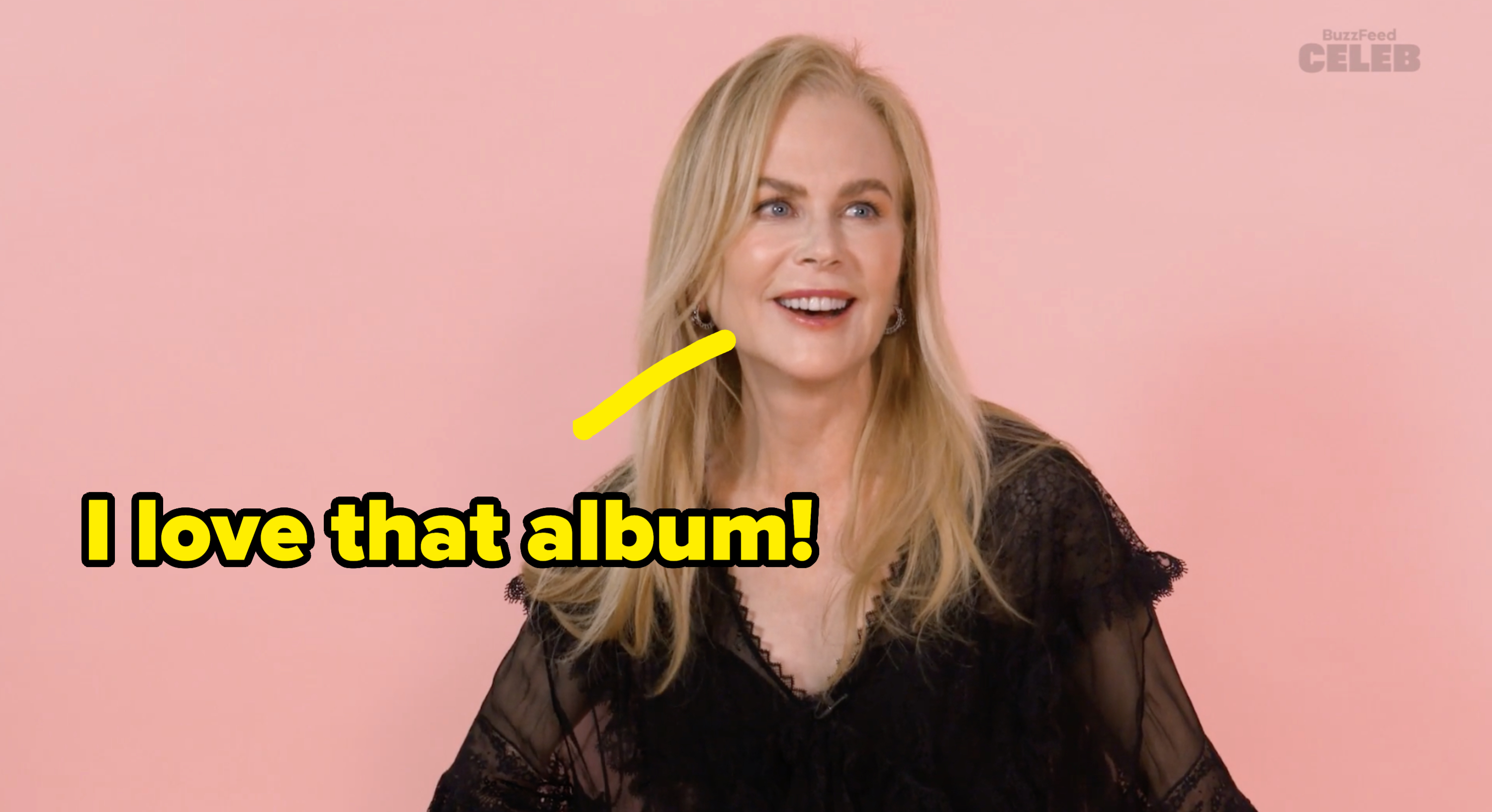 Nicole Kidman smiling, dressed in a lace blouse, against a plain background with a BuzzFeed Celeb watermark
