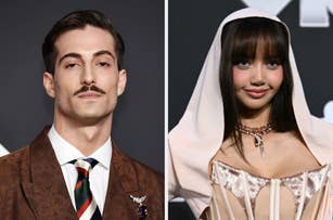 Two individuals are shown on the red carpet: Damiano David with a mustache in a patterned suit and tie, and Lisa with bangs, in a hooded, off-shoulder outfit