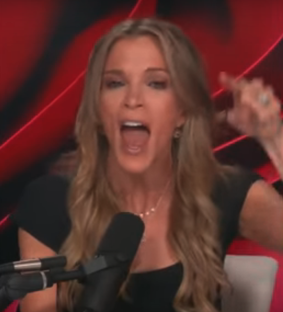 Woman speaking into a microphone with a passionate expression and gesturing with her hand during a recorded segment