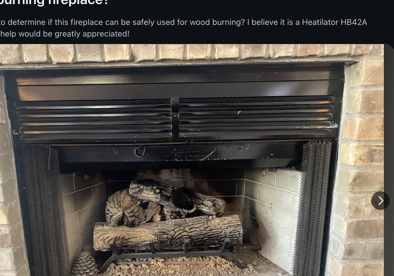 Screenshot of a Reddit post in the r/Fireplaces subreddit. The post titled "Wood burning fireplace?" seeks advice on whether the pictured fireplace can be used for burning wood