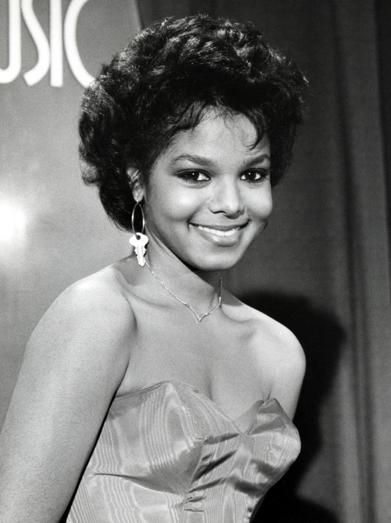 Janet Jackson poses on the red carpet in a strapless dress