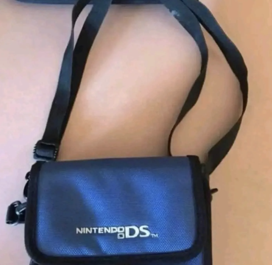 A Nintendo DS carrying case with a shoulder strap