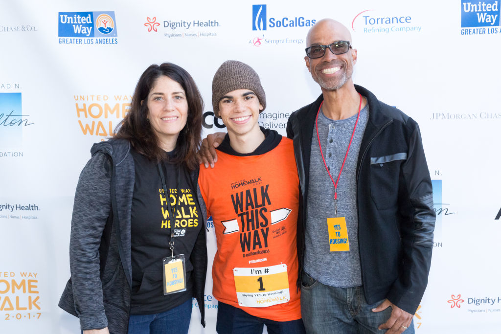(Left to Right) Libby Boyce, Cameron Boyce, and Victor Boyce at United Way’s HomeWalk event, with Cameron wearing an orange event t-shirt and a beanie