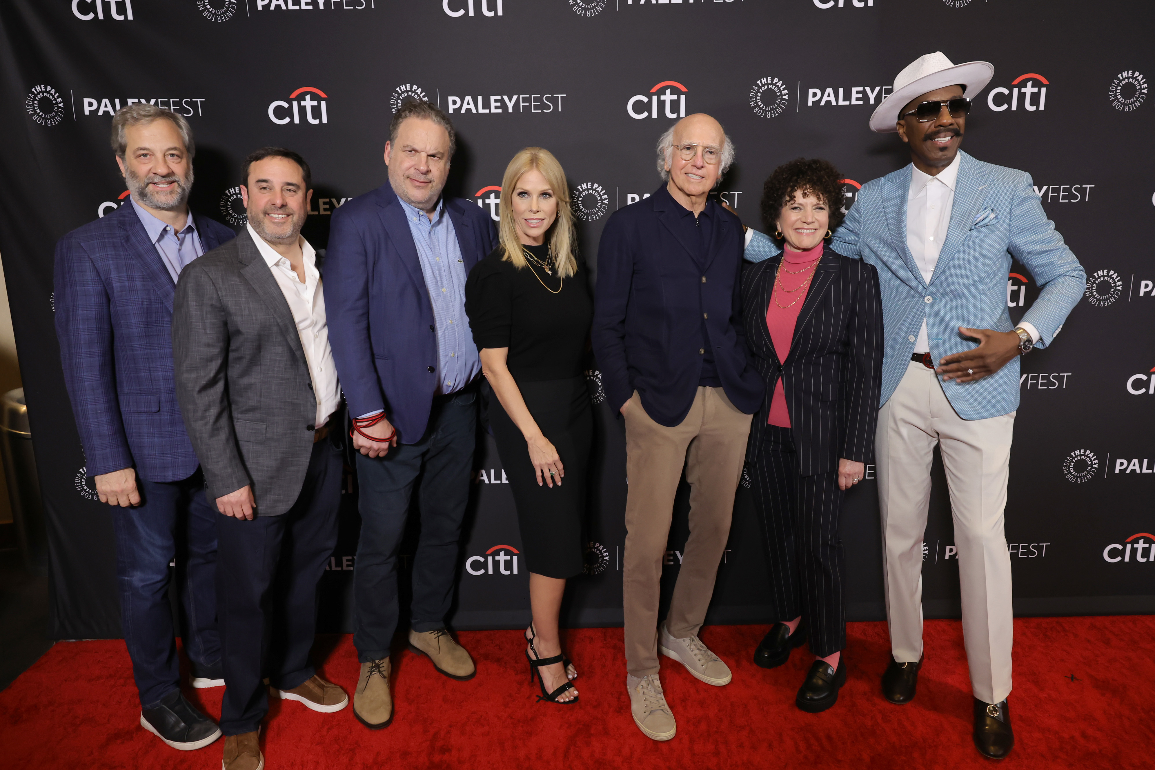 A group stand on the red carpet at PaleyFest