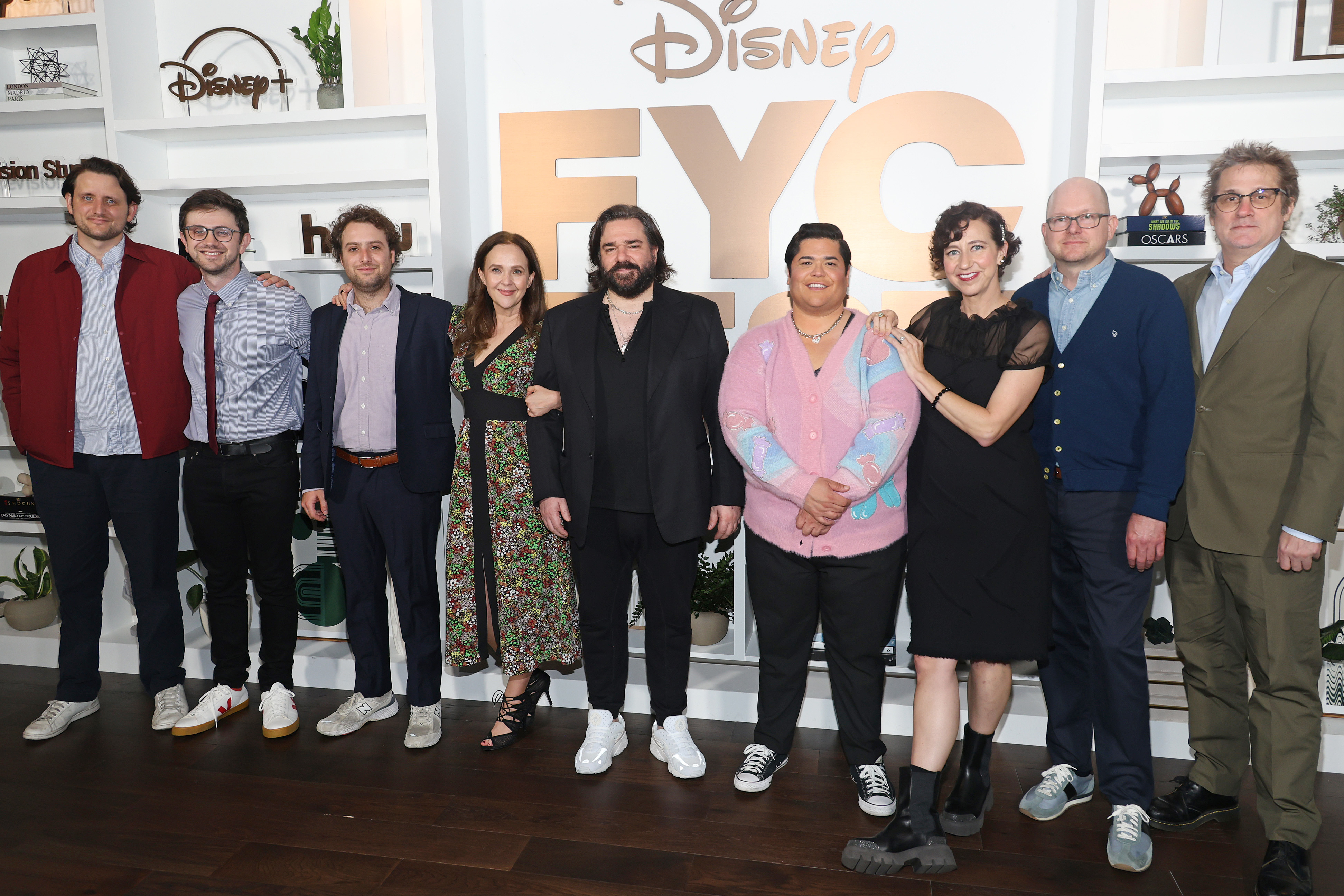 Group photo of eight people at a Disney event for What We Do in the Shadows.
