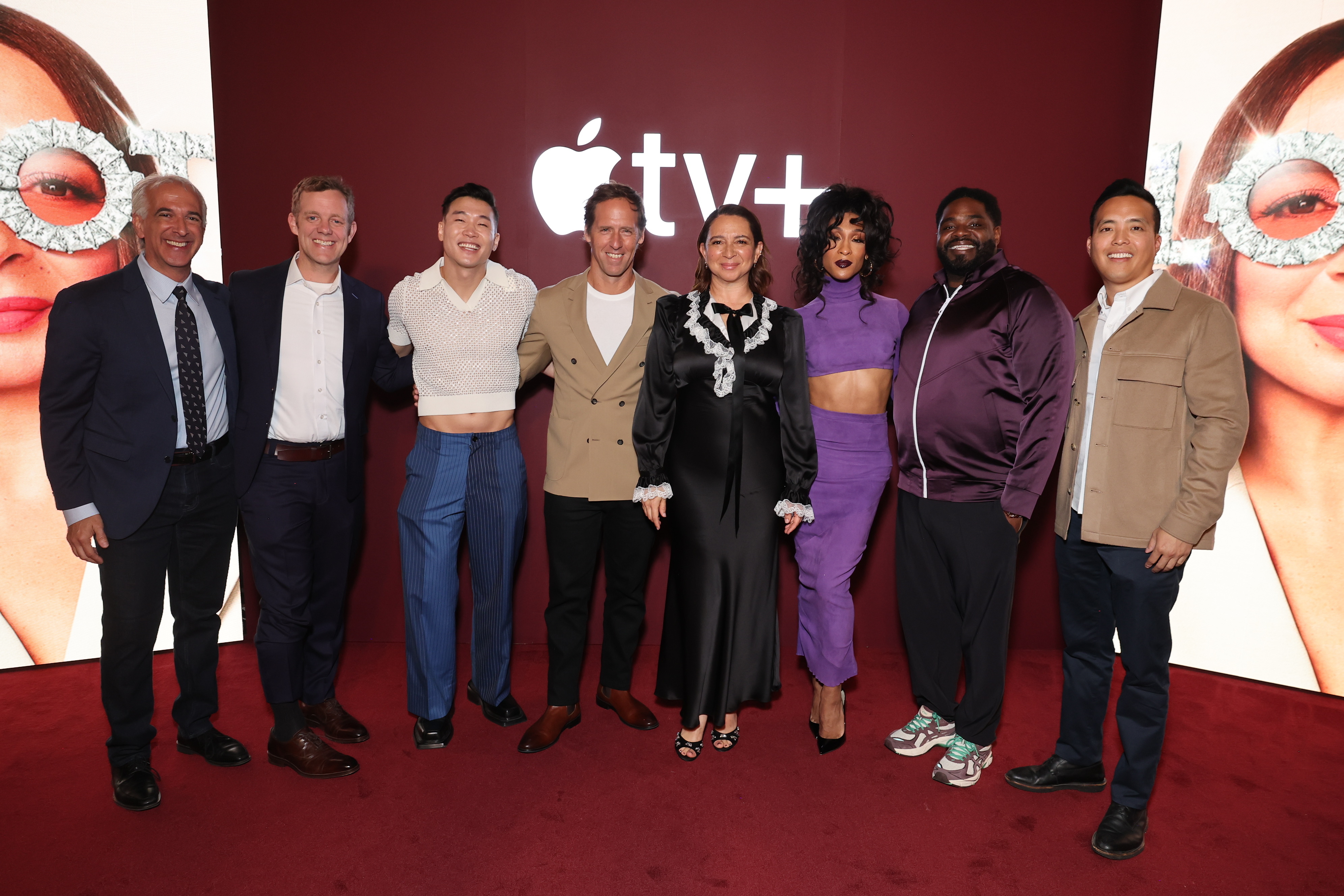 Eight people posing together at an Apple TV+ event