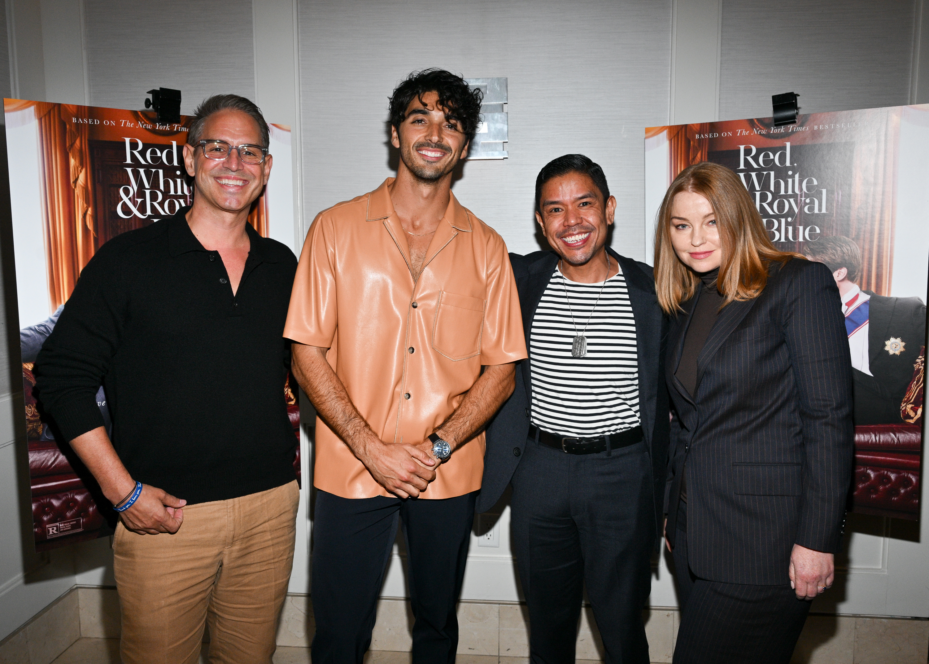 Four people standing together at a "Red, White &amp;amp; Royal Blue" event