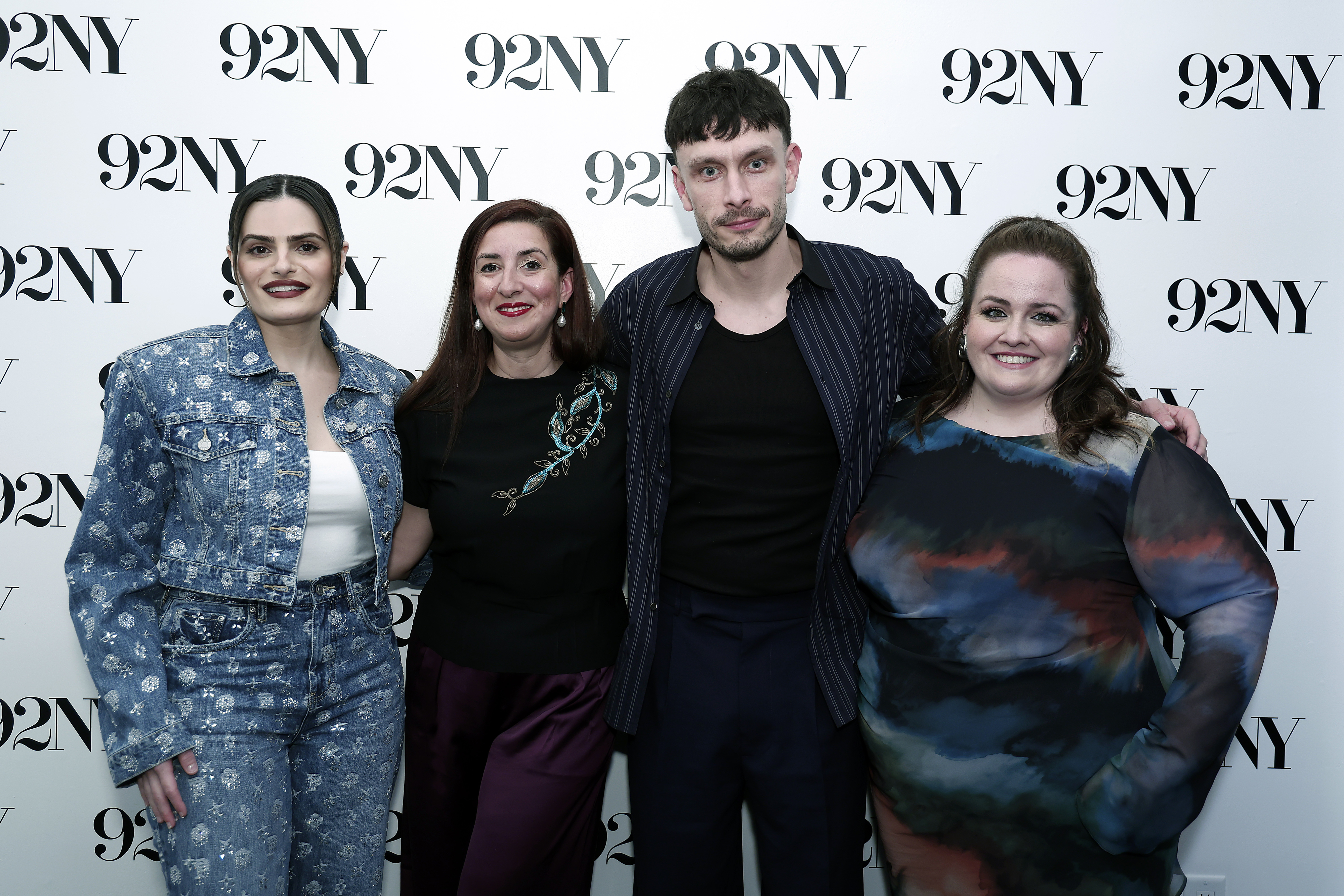 The cast of Baby Reindeer stand in front of a 92NY backdrop. They are dressed in a variety of stylish clothing