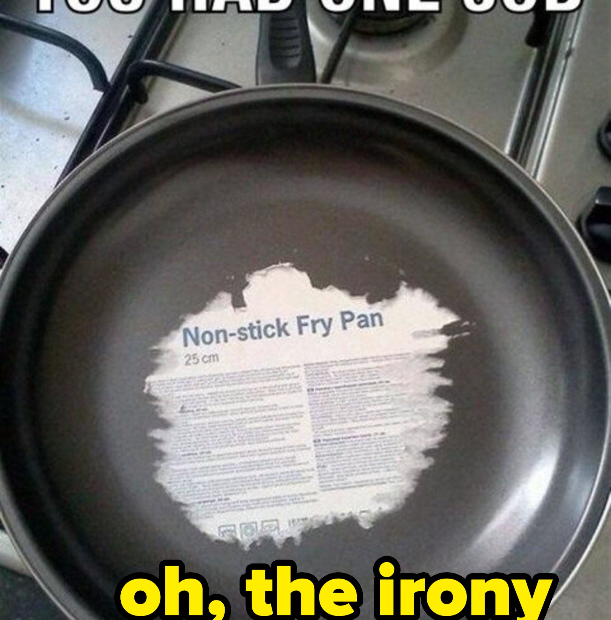 Image of a stove with a frying pan that has a non-stick label stuck to its middle