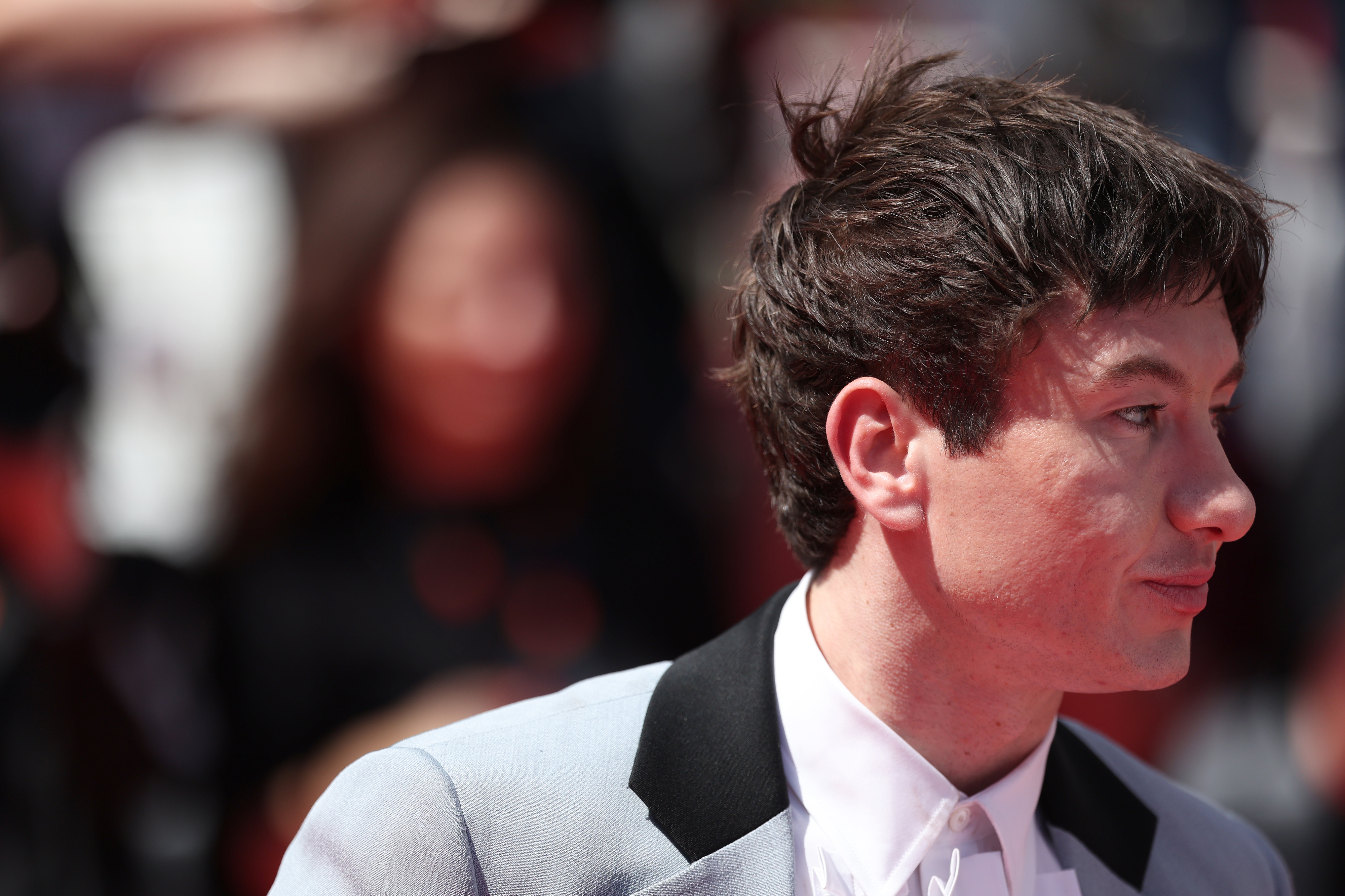 Barry Keoghan on the red carpet, wearing a stylish suit with a lapel and shirt