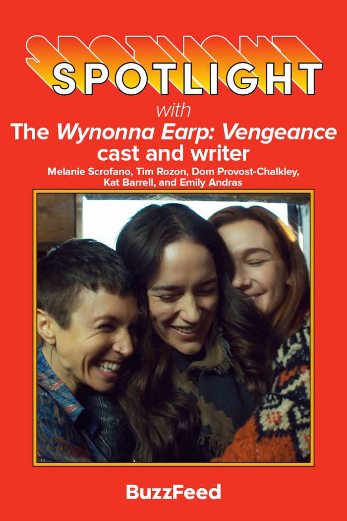 Melanie Scrofano, Tim Rozon, Dom Provost-Chalkley, Kat Barrell, and Emily Andras laughing together, promoting "The Wynonna Earp: Vengeance" on BuzzFeed