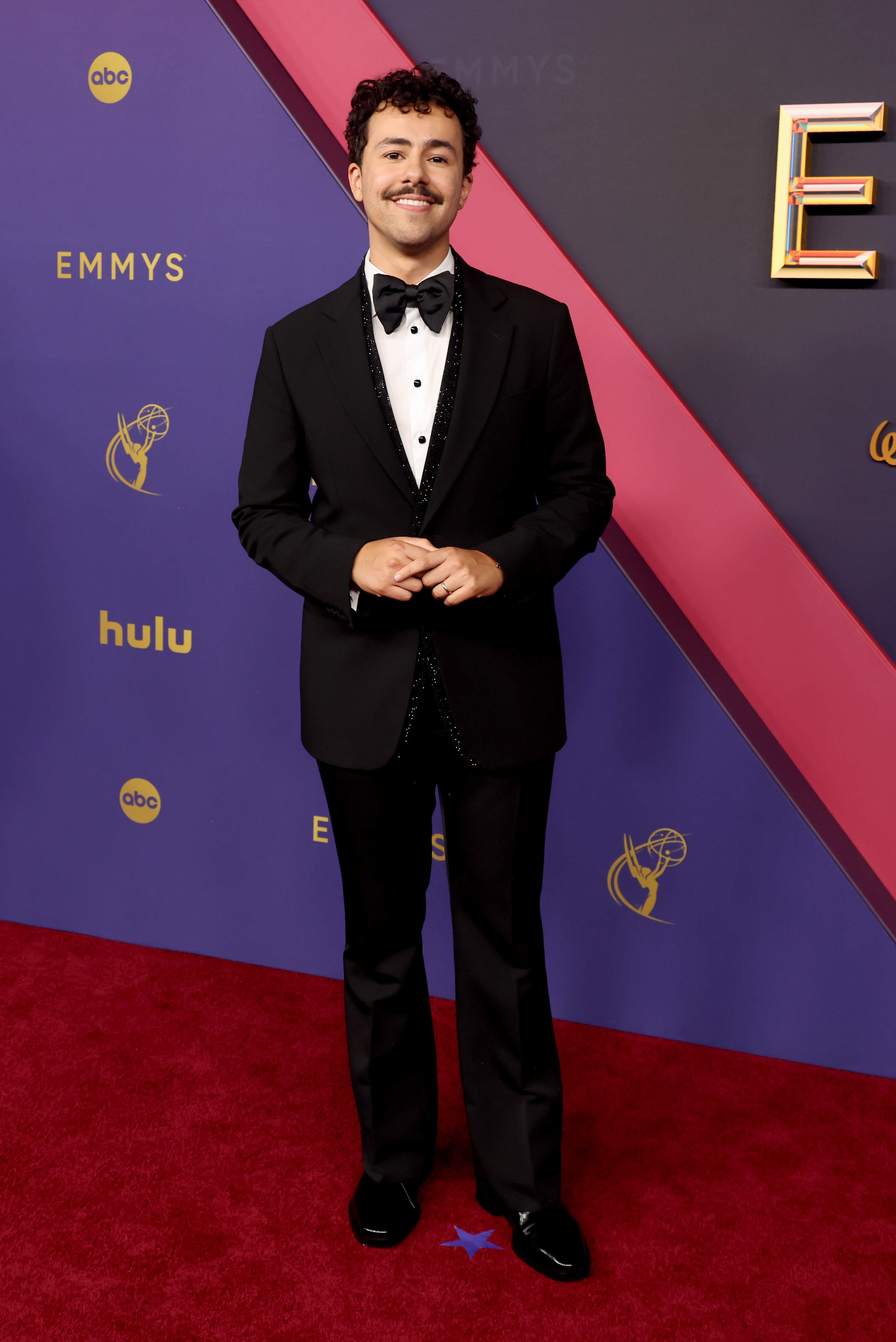 Ramy Youssef at the Emmys, wearing a tuxedo with a bow tie