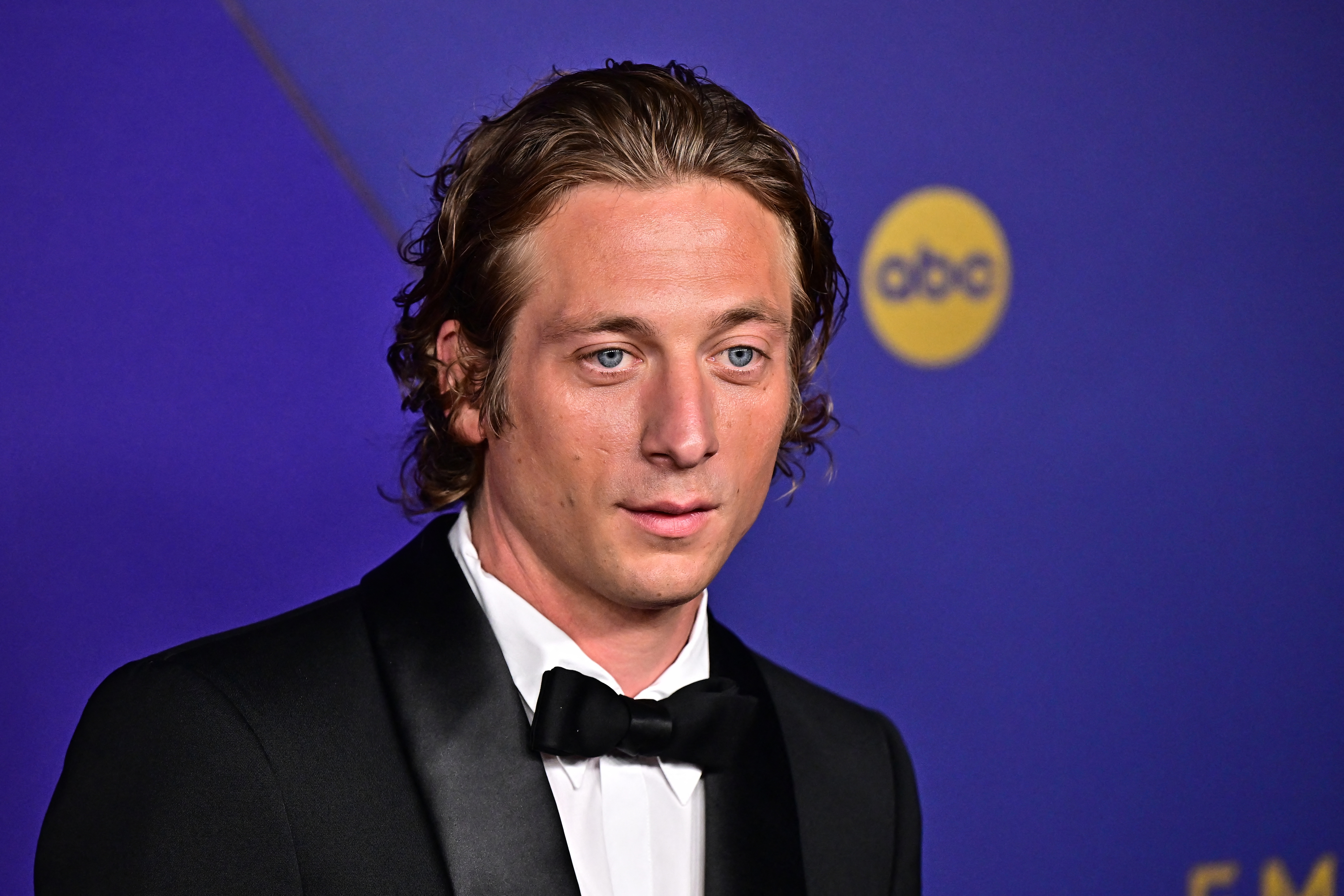 Jeremy Allen White in a tuxedo with a bow tie at a celebrity event