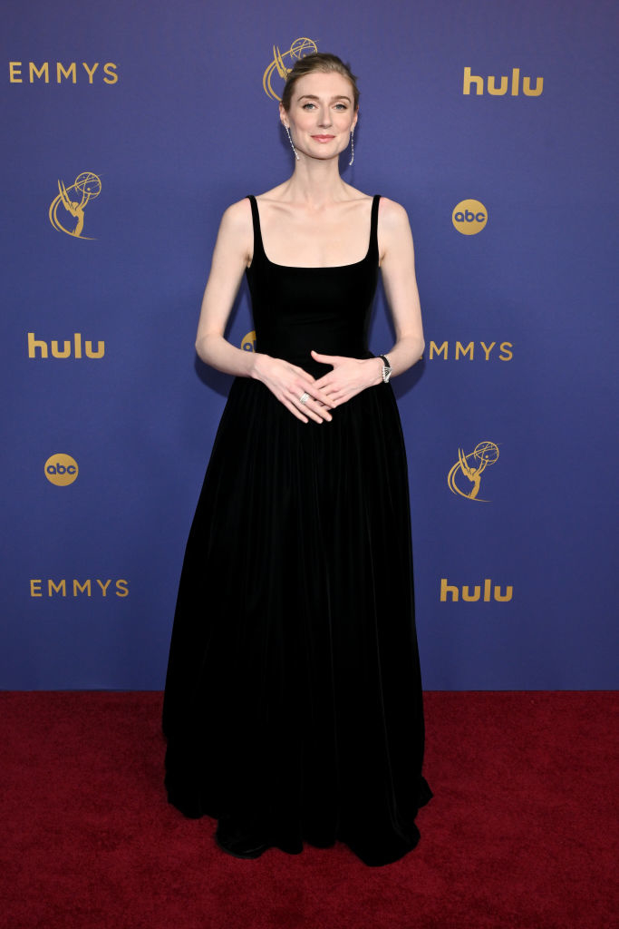 Elizabeth Debicki at the Emmys, wearing an elegant, sleeveless gown with minimal jewelry on the red carpet