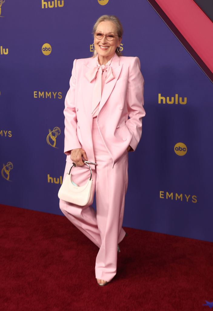 Meryl Streep on the red carpet at the Emmys, wearing a stylish tailored suit