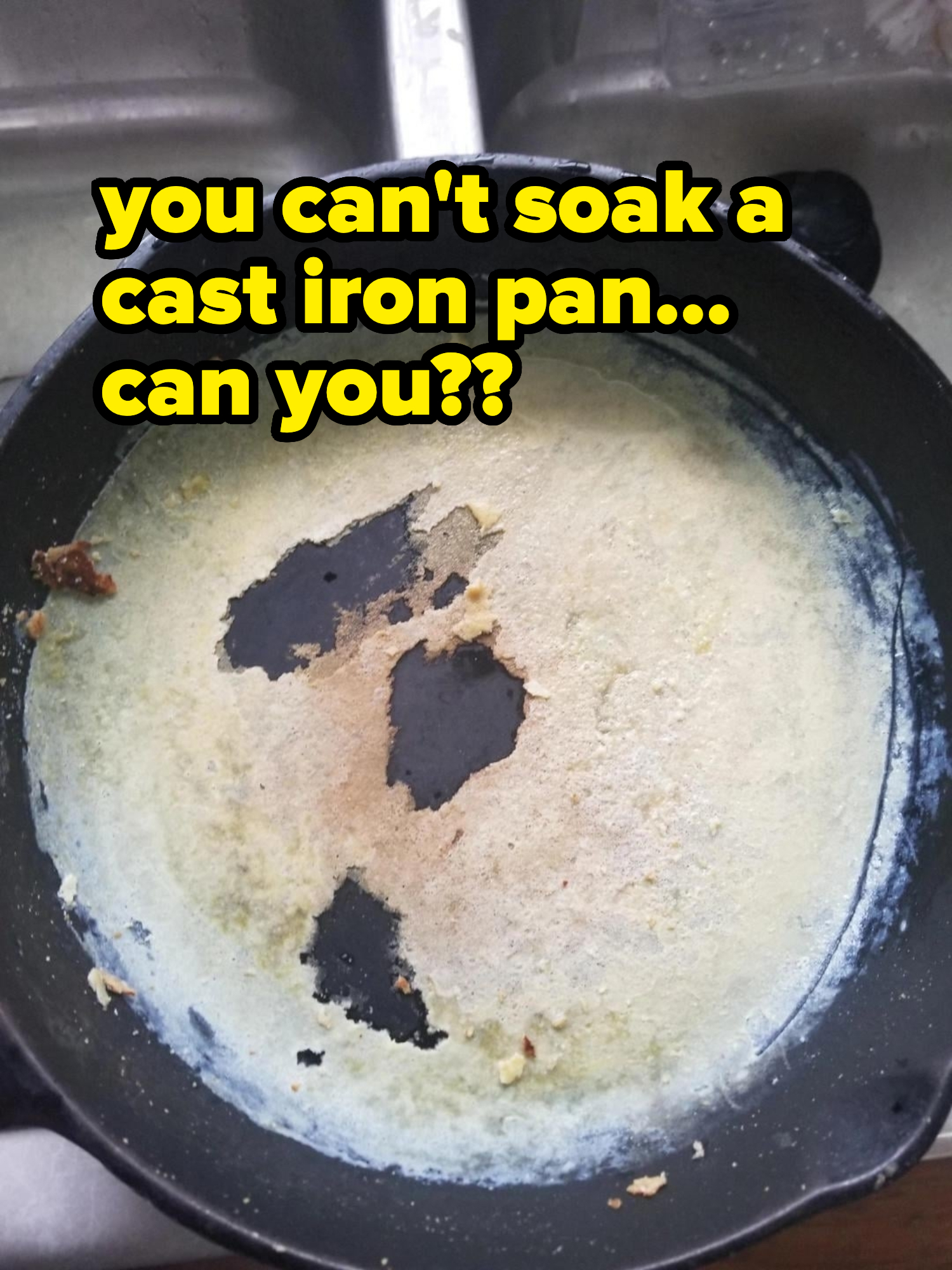 A dirty cast-iron skillet with food residue stuck to its surface is shown in the image
